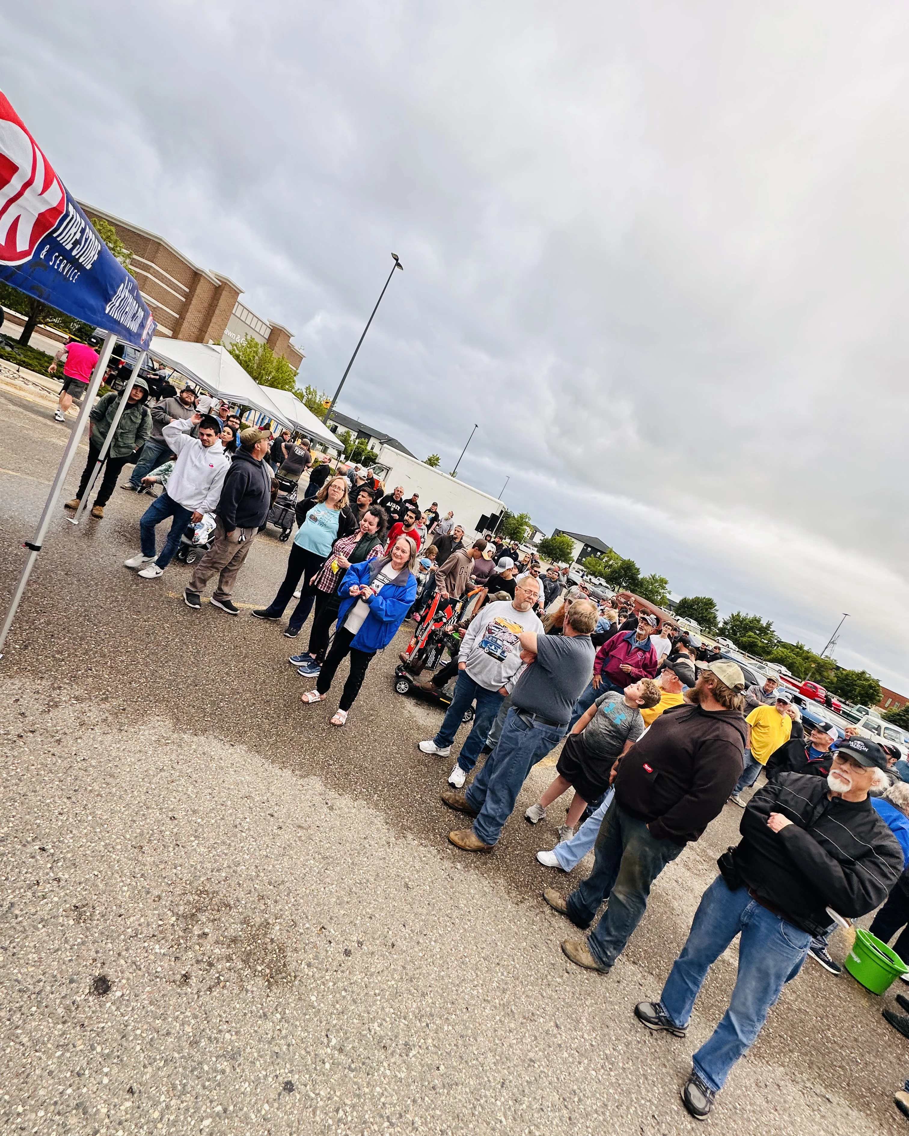 Large crowd gathered under the OK Tire tent for the door prize drawing